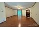 Spacious living room with wood floors, fireplace, and sliding glass doors at 400 Archibald Rd, Concord, NC 28025