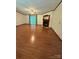 Spacious living room with wood floors, fireplace, and sliding glass doors at 400 Archibald Rd, Concord, NC 28025