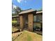 Arched glass doors to a brick building with grass yard in front and clear skies above at 415 Orchard Trace Ln # 8, Charlotte, NC 28213