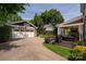Spacious backyard featuring a detached garage with basketball hoop and a covered patio at 417 N Dotger Ave, Charlotte, NC 28204