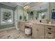 Bathroom features double sinks, vanity, and a clawfoot tub under a large window at 417 N Dotger Ave, Charlotte, NC 28204