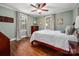 Cozy bedroom featuring two windows and hardwood floors at 417 N Dotger Ave, Charlotte, NC 28204