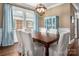 Beautiful dining room with hardwood floors, a statement lighting fixture and natural light at 417 N Dotger Ave, Charlotte, NC 28204