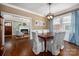 Cozy dining room with beautiful hardwood floors and a view into the living room at 417 N Dotger Ave, Charlotte, NC 28204
