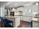 Modern kitchen island with granite countertops and stainless steel appliances at 417 N Dotger Ave, Charlotte, NC 28204