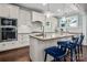 Charming kitchen island with granite countertops and seating, perfect for entertaining at 417 N Dotger Ave, Charlotte, NC 28204