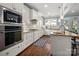 Bright kitchen with white cabinets, granite countertops, and stainless steel appliances at 417 N Dotger Ave, Charlotte, NC 28204
