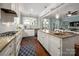 Spacious kitchen with island features granite countertops and white cabinetry at 417 N Dotger Ave, Charlotte, NC 28204