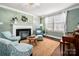 Bright living room with fireplace, stylish furnishings, and large windows at 417 N Dotger Ave, Charlotte, NC 28204
