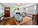 Cozy living room features a fireplace, hardwood floors, and ample natural light at 417 N Dotger Ave, Charlotte, NC 28204