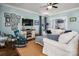 Bright living room features hardwood floors, a comfortable sofa, and a stylish rocking chair at 417 N Dotger Ave, Charlotte, NC 28204