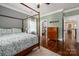 This main bedroom features hardwood floors, an ensuite bathroom, and a walk-in closet at 417 N Dotger Ave, Charlotte, NC 28204