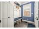 Charming mudroom features a built-in bench, storage cabinets and shelving at 417 N Dotger Ave, Charlotte, NC 28204