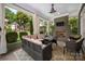 Covered patio with comfortable outdoor furniture, fireplace, and view of the backyard at 417 N Dotger Ave, Charlotte, NC 28204