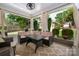 Outdoor patio with comfortable sectional seating, table, and a ceiling fan for pleasant gatherings at 417 N Dotger Ave, Charlotte, NC 28204