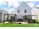 Inviting backyard featuring a patio with pergola, hot tub, and lush green lawn, perfect for outdoor living and entertaining at 417 Trillium Sw Ct, Conover, NC 28613