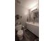 Bathroom featuring a single sink vanity and a commode with decorative items at 417 Trillium Sw Ct, Conover, NC 28613