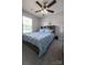 Bedroom featuring a gray bookcase headboard and neutral gray carpet at 417 Trillium Sw Ct, Conover, NC 28613