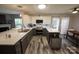 Modern kitchen featuring stainless steel appliances, white countertops, and stylish gray lower cabinets at 417 Trillium Sw Ct, Conover, NC 28613