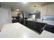 Bright and airy kitchen with white countertops, gray cabinets, and stainless steel appliances at 417 Trillium Sw Ct, Conover, NC 28613