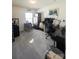 This office is well lit and furnished with two desks and a piano at 417 Trillium Sw Ct, Conover, NC 28613