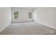 Spacious bedroom with soft carpet and large windows offering plenty of natural light at 432 Bent Burr Crk, York, SC 29745