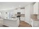 Modern kitchen boasts white cabinets, stainless steel appliances, and a large center island at 432 Bent Burr Crk, York, SC 29745