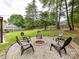 A backyard fire pit surrounded by a circle of chairs at 4711 Truscott Rd, Charlotte, NC 28226