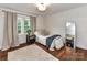 Comfortable bedroom with natural light, a beige rug, and a single bed at 4711 Truscott Rd, Charlotte, NC 28226