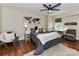 This bedroom features hardwood floors, decor, and a ceiling fan at 4711 Truscott Rd, Charlotte, NC 28226