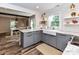 Eat in kitchen with modern finishes and an open floor plan to the dining room at 4711 Truscott Rd, Charlotte, NC 28226