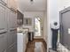 Well-equipped laundry room featuring modern appliances, cabinet storage, and convenient outdoor access at 4711 Truscott Rd, Charlotte, NC 28226