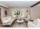 Cozy living room with neutral decor, hardwood floors, and plenty of natural light at 4711 Truscott Rd, Charlotte, NC 28226