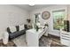 Comfortable office with a sofa, plants, and ample sunlight creating a motivating workspace at 4711 Truscott Rd, Charlotte, NC 28226