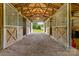 Interior view of a barn with stall doors and ample open space at 4855 Saluda Rd, Rock Hill, SC 29730