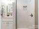 Bathroom with a walk-in shower and built in shelves, complemented by a neutral vanity area at 4855 Saluda Rd, Rock Hill, SC 29730