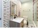 Stylized bathroom features a unique brick wall, modern vanity, and decorative tile flooring at 4855 Saluda Rd, Rock Hill, SC 29730