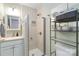 Bathroom features a glass-door shower and light green walls, complete with storage shelves at 4855 Saluda Rd, Rock Hill, SC 29730