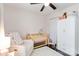 Bedroom features a cozy chair, crib, and white closet at 4855 Saluda Rd, Rock Hill, SC 29730