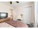 Bedroom with hardwood floors, desk, closet, and a view into the hallway at 4855 Saluda Rd, Rock Hill, SC 29730