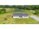 Expansive property features a white ranch home, large outbuilding, and fenced pastureland at 4855 Saluda Rd, Rock Hill, SC 29730