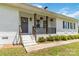 Close up of home's entryway featuring small porch and well-kept yard at 4855 Saluda Rd, Rock Hill, SC 29730