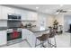 Bright kitchen with granite countertops, white cabinets, and stainless steel appliances at 4855 Saluda Rd, Rock Hill, SC 29730