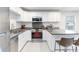 Updated kitchen with stainless steel appliances, white cabinets, and granite countertops at 4855 Saluda Rd, Rock Hill, SC 29730