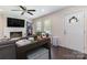 Inviting living room features a painted brick fireplace and dark wood floors at 4855 Saluda Rd, Rock Hill, SC 29730