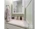 Bathroom vanity with white marble countertop, chrome faucet, grey towels, and painted green walls at 4855 Saluda Rd, Rock Hill, SC 29730