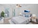 Cozy bedroom features natural light from two windows and soft carpet at 513 N Graham St # 1B, Charlotte, NC 28202