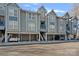 Multi-level home exterior showcasing garage and covered stair access to upper floor at 513 N Graham St # 1B, Charlotte, NC 28202