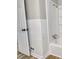 A view of the bathroom showing the tub with shower and tile surround at 5221 Wales St, Charlotte, NC 28269