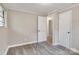 This bedroom has hardwood floors, neutral paint, and a closet at 5221 Wales St, Charlotte, NC 28269